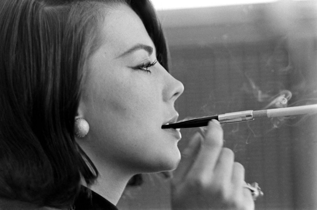 Natalie Wood smokes with Steve McQueen in 1963.