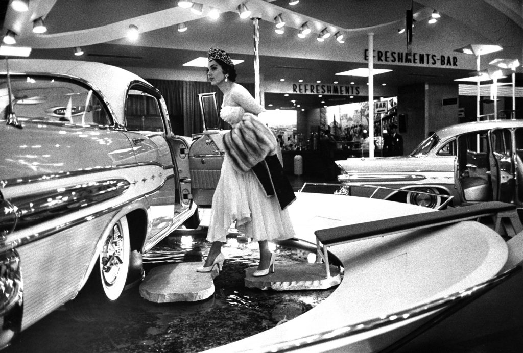 National Automobile Show at the New York Coliseum featuring 1957 lines.