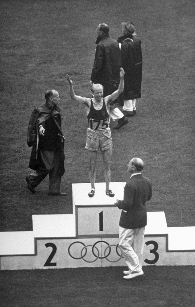Gaston Reiff of Belgium stands on the winner's block after the 5,000 meters, London Summer Olympics, 1948.